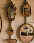 Gallery wall of antique mirrors
