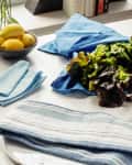 5 different types of kitchen towels arranged in the kitchen