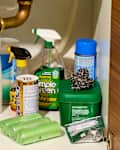 head on shot of assorted cleaning supplies under the sink