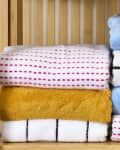 head on shot of an assortment of towels on a shelf