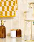 head on shot of the umbra jewelry holder on a bathroom counter.