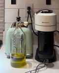 Nespresso maker on kitchen counter.