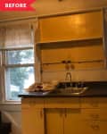 Yellow kitchen cabinets with a stainless steel sink, red countertop, and two windows with white curtains.