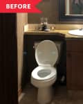 Small bathroom with wooden vanity, round sink, and toilet. Brown walls and mirror above the sink.
