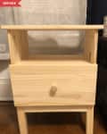 Unfinished wooden nightstand with a single drawer and open shelf.