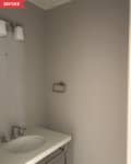 Before: Bare powder room with beige walls