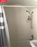 Before: dingy tiled shower