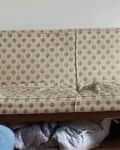 Before: faded, yellowed vintage couch with sagging seat