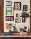 gallery wall with frames painted different colors