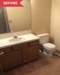 Small bathroom with beige walls, wooden vanity, white sink, and toilet. Brown carpet flooring and large mirror above sink.