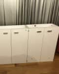 Before: Three separate white cabinets