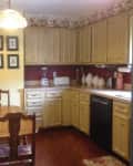 Before: Outdated kitchen with floral wallpaper border