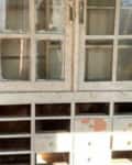 Before: Run-down china cabinet with paint on glass and drawers missing