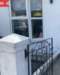 before: blue front door with plain concrete pathway