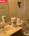Before: Dingy bathroom with dirty grout and holes in wall