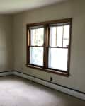 Before: dark living room with beige carpets and beige walls