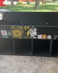 Before: record cabinet painted black and covered with stickers