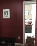 Before: Dark, cramped entryway with deep red walls
