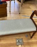 Before: Bench with dingy striped fabric upholstery