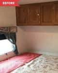 Before: Bed with floral quilt beneath brown wooden cabinets