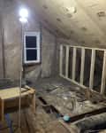 Before: Unfinished attic with slanted roof line