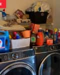 messy laundry room before remodel