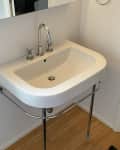 Before: Pedestal sink in bathroom