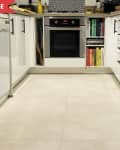 Before: White kitchen with white tile floors