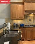 Wooden kitchen cabinets, black countertops, tile backsplash, stainless steel sink, and a blue pot on the stove.
