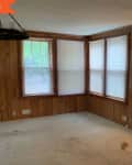 Before photo with wooden walls