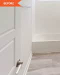 Before: Bathroom with brown vanity, light brown-gray wood look floors, and white walls