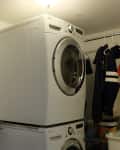 Before: Stacked washer/dryer in corner of laundry room