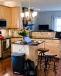 Before: full view of brown wooden kitchen