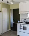 Before: kitchen with green/yellow walls and white appliances