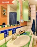 Colorful bathroom with green tile countertop, orange walls, blue shower curtain, and green cabinet with towels.