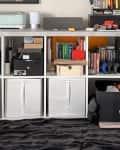 White storage unit with various items including a printer, books, cameras, and storage bins, labeled "Before."