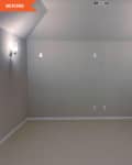 Before: an empty white room