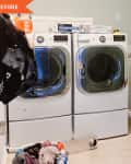 Before: unpainted laundry room with exposed wires