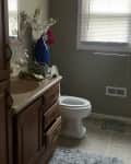 Before: Dated beige bathroom