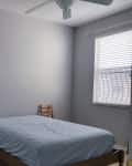 Before: a gray bedroom with a ladder and a mattress