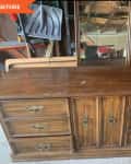 Before: a short, brown wooden wardrobe with multiple drawers