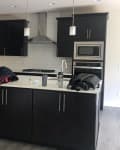 Before: a kitchen with brown cabinets and a brown island