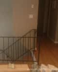 Before: a metal railing at the top of the stairs