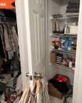 Before: a closet with hangers on the door knob