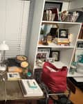 Before: Cluttered office with desk in front of window