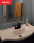 Before: Bathroom with light blue walls and a dark wood vanity with a white sink and black faucet