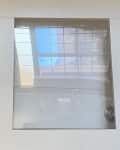 Before: a white frame with three glass panels