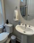 Before: a beige painted bathroom wall