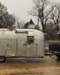Before: the outside of a rusted metal trailer