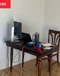 Before: Desk in corner of office with white walls